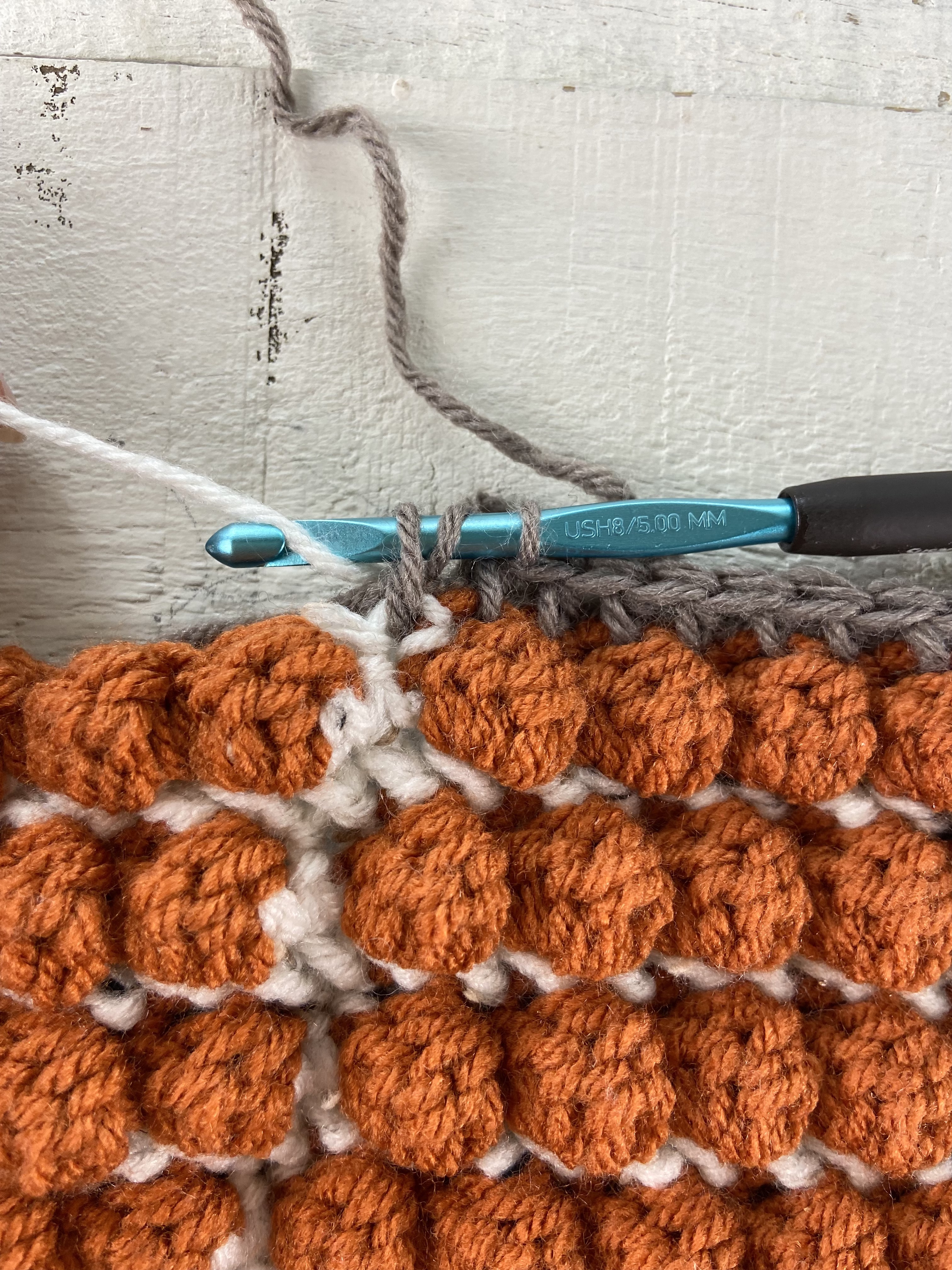 Use regular hdc for the stem. Use hhdc for the Ivory stitches on either side of the stem.