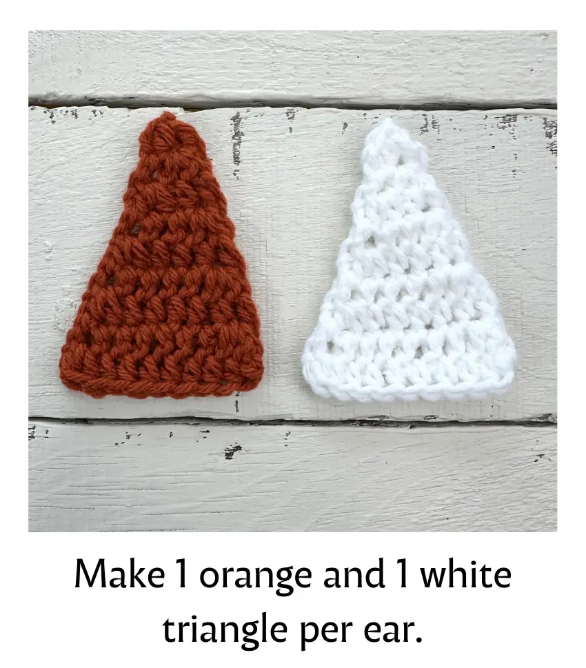One orange and one white crochet triangle for fox ear.